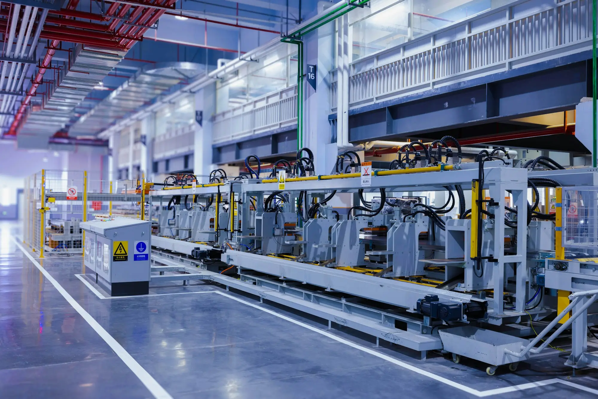Large piece of manufacturing machinery inside a factory building